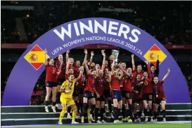  ?? JOSE BRETON — THE ASSOCIATED PRESS ?? Spain’s team captain Irene Paredes lifts the trophy after winning the Women’s Nations League final soccer match between Spain and France at La Cartuja stadium in Seville, Spain, Wednesday, Feb. 28, 2024. Spain won 2-0.