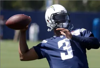  ?? AP Photo /Chris Carlson ?? In this June 12 file photo, Los Angeles Chargers’ Geno Smith throws a pass during the NFL football team’s minicamp in Costa Mesa, Calif.