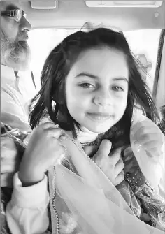  ??  ?? File photo of Zainab Fatima Ameen, six, in a vehicle with her father in Kasur.