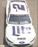  ?? Jerry Markland / Getty Images ?? Brad Keselowski drives through the garage area during practice for the Firekeeper­s Casino 400 at Michigan Internatio­nal Speedway in Brooklyn, Mich., on Friday.