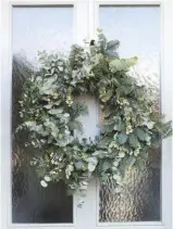  ??  ?? front door Kerry made the eucalyptus and spruce wreath that welcomes guests. Borrowed Light exterior eggshell is a match for the door colour, £67 for 2.5L, Farrow &amp; Ball