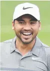  ??  ?? Jason Day enjoys a lighter moment in the pro-am.