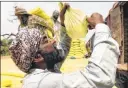  ?? —AFP ?? A labourer takes a break from work at a railway yard on a hot Saturday in Amritsar.