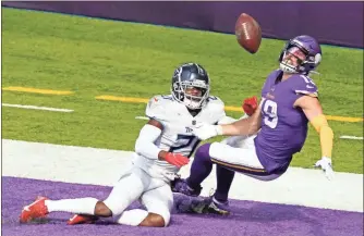  ?? AP-JIM Mone ?? Tennessee Titans cornerback Malcolm Butler, left, breaks up a pass intended for Minnesota Vikings wide receiver Adam Thielen (19) in the end zone during the first half of an NFL football game, Sunday, Sept. 27, 2020, in Minneapoli­s.