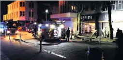  ??  ?? Firefighte­rs at the incident at Crouch jewellers in Oxford Street, Swansea.