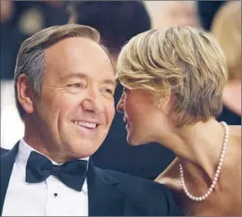  ?? Melinda Sue Gordon Netf lix ?? left, and Robin Wright star in the political drama “House of Cards.” Netf lix will make the entire 13-episode season available all at once.