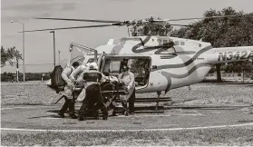  ?? Christophe­r Lee / New York Times ?? Medical staff at Starr County Memorial Hospital in Rio Grande City move a patient to a helicopter to be transporte­d to a larger hospital on Aug. 1.