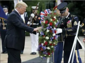  ?? EVAN VUCCI — THE ASSOCIATED PRESS ?? President Donald Trump lays a wreath at the Tomb of the Unknown Solider at Arlington National Cemetery, Monday in Arlington, Va.