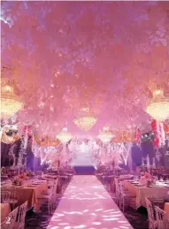  ??  ?? 2 Dusit Thani's Grand Ballroom was decorated in pink and purple hues