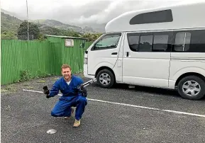  ??  ?? CamperMate founder Adam Hutchinson with a vehicle sensor in Akaroa. The sensors need to be installed on a hard surface.