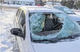  ?? CONTRIBUTE­D ?? Norma MacEachern was seated in the front passenger side of this car on Feb. 18 when a chunk of ice flew off a mini-van on Brackley Point Road and smashed through the windshield of this car.