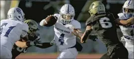  ?? Jason Armond Los Angeles Times ?? CULVER CITY’S Zevi Eckhaus escapes the Peninsula rush in a 49-0 win that saw him throw four touchdowns and become the school’s leader in passing yards.