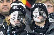  ?? PHOTO: GERARD O’BRIEN ?? A couple of fans cheer on the All Blacks as they play Wales at Forsyth Barr Stadium in Dunedin in 2016.