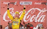  ?? AP PHOTO BY CHUCK BURTON ?? Kyle Busch celebrates after winning the NASCAR Cup Series auto race at Charlotte Motor Speedway in Charlotte, N.C., Sunday, May 27.