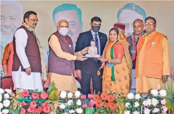  ?? — PTI ?? Prime Minister Narendra Modi and others during a public meeting ahead of the second phase of UP Assembly polls, in Kannauj on Saturday.