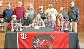  ?? Jennie Coker ?? Calhoun Softball senior Carlie Henderson signs with the University of South Carolina at the Calhoun High School Media Center on Wednesday, Nov. 13.