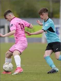  ??  ?? Dylan McEvoy of Wexford is closed down by Ryan McCarthy.