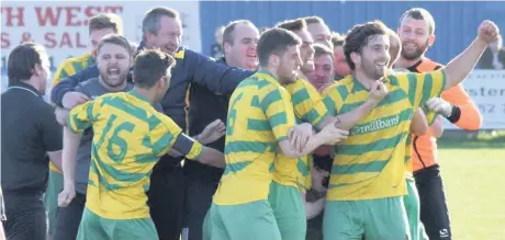  ?? James Eastup ?? Runcorn Linnets boss Michael Ellison, second left (with beard), joins in the celebratio­ns as his team secure a dramatic comeback win over Bootle last season.