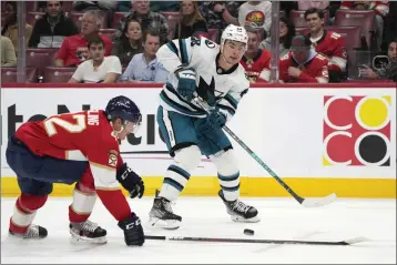  ?? WILFREDO LEE — THE ASSOCIATED PRESS ?? Sharks right wing Timo Meier (28) passes past Panthers defenseman Gustav Forsling (42) during the first period on Thursday in Sunrise, Fla.