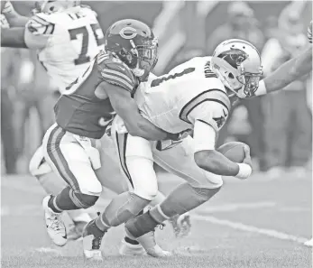  ?? DENNIS WIERZBICKI, USA TODAY SPORTS ?? Panthers quarterbac­k Cam Newton is sacked by Bears inside linebacker Danny Trevathan during the first quarter at Soldier Field.