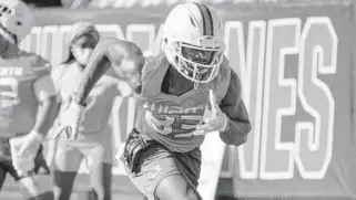  ?? TIM
BROGDON/MIAMI ATHLETICS ?? Hurricanes wide receiver Michael Redding III during the first day of UM spring football drills on Monday.