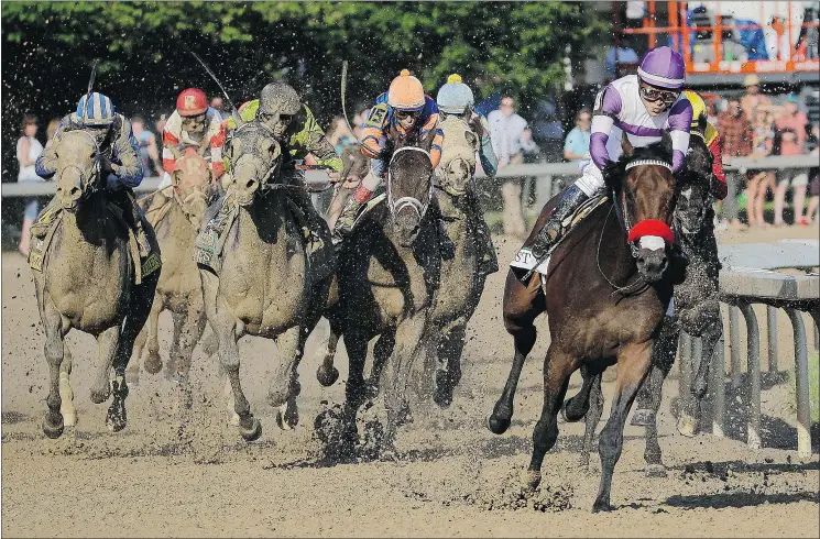  ?? — THE ASSOCIATED PRESS ?? Vancouver’s Mario Gutierrez rides Nyquist to victory during the 142nd running of the Kentucky Derby at Churchill Downs Saturday in Louisville.