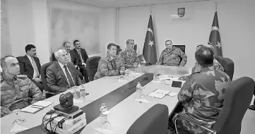  ??  ?? Photo shows Erdogan (right) flanked by Chief of the General Staff of the Turkish Armed Forces Hulusi Akar (second right) being informed during his visit to Operating Base in Hatay on the sixth day of ‘Operation Olive Branch’. — AFP photo