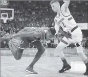  ?? STEVE YEATER – THE ASSOCIATED PRESS ?? Kansas’ Lagerald Vick, left, drives to the basket around Stanford’s Robert Cartwright during Thursday’s game.