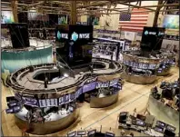  ?? AP/RICHARD DREW ?? The floor of the New York Stock Exchange is empty on Monday after all major U.S. stock and option exchanges closed because of Hurricane Sandy. Markets will remain closed today.