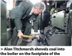  ?? Andrew Matthews ?? > Alan Titchmarsh shovels coal into the boiler on the footplate of the Flying Scotsman