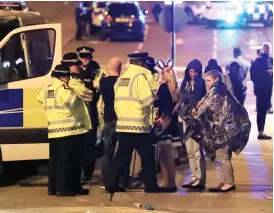  ??  ?? Emergency services at Manchester Arena after reports of an explosion at the venue during an Ariana Grande gig PA