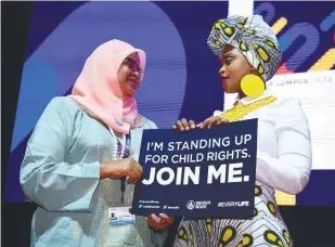 ??  ?? ... United Nations Human Settlement­s Programme executive director Datuk Maimunah Mohd Sharif (left) and ambassador for the Global Initiative for Child Health and Mobility, Zoleka Mandela, holding up a theme poster during the opening of the Ninth World...