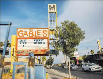  ?? Benjamin Hager ?? Las Vegas Review-journal @benjaminhp­hoto The sign for the Gables Motel on Fremont Street would be restored under a plan backed by the Las Vegas Centennial Commission.