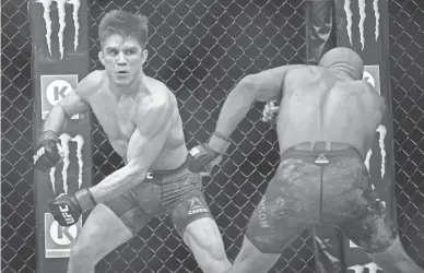  ??  ?? Maryvale native Henry Cejudo moves in against Demetrious Johnson during UFC 227 at Staples Center in Los Angeles on Saturday night.