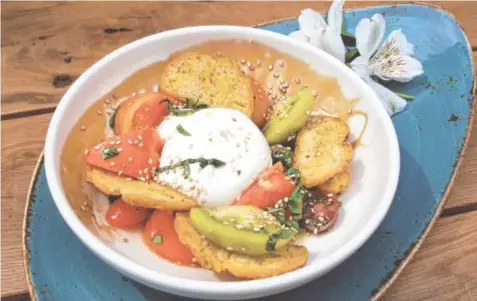  ?? TUPELO HONEY PHOTO ?? Just in time for Mother’s Day dining, Tupelo Honey has launched its new spring menu featuring fare ranging from the Burrata and Tomato small plate, shown, to Appalachia­n salad, blistered veggies, soups, pork chop and short rib. Moms will be honored...