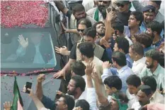  ?? — AFP ?? Nawaz Sharif waves to supporters from his car as he begins a rally from Islamabad to Lahore on Wednesday.