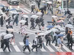  ??  ?? SOLDIERING ON: People walk on Shibuya crossing in Tokyo on Friday during a coronaviru­s state of emergency covering Tokyo, Osaka, Kyoto and Hyogo regions.