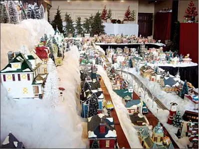  ?? Photo courtesy of the Eureka Springs Historical Museum ?? Larry and Cathy Handley’s array of 300 Snow Village pieces, on display in Eureka Springs, is the largest private collection of these miniatures in the South. Or at least, Larry Handley says, nobody has told him it isn’t.