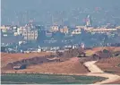  ?? LEO CORREA/AP ?? Israeli tanks stand at the border with the Gaza Strip, as seen Monday from southern Israel.