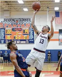  ?? Craig Moseley / Houston Chronicle ?? Tompkins’ C.J. Washington (13) stated his case for receiving a college scholarshi­p offer by scoring 23 and 20 points in the two regional games last week.