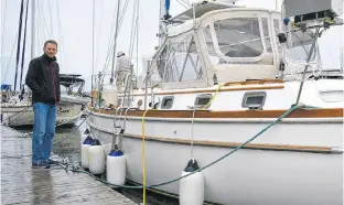  ?? DESIREE ANSTEY/JOURNAL PIONEER ?? Paul Bingham planned to ride out the storm on his vessel docked in the Summerside marina.