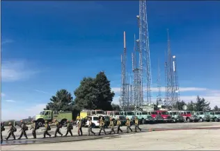  ?? Courtesy photo ?? Local firefighte­rs prepare to fight a fire on Mt. Wilson on Wednesday.