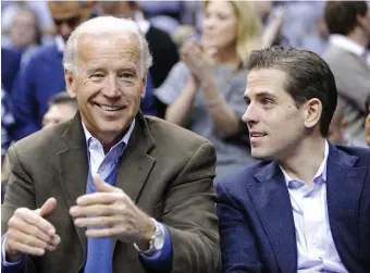  ?? AP file ?? IN THE SHADE: President-elect Joe Biden and his son Hunter Biden have managed to keep news about Hunter Biden’s business and tax dealings out of the limelight.