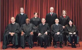  ?? ERIN SCHAFF/POOL PHOTO ?? From left, Justices Samuel Alito, Brett Kavanaugh, Clarence Thomas and Elena Kagan, Chief Justice John Roberts and Justices Neil Gorsuch, Stephen Breyer, Amy Coney Barrett and Sonia Sotomayor.