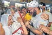  ?? PTI ?? Family members of Sawinder Singh, who was killed in an attack on a gurdwara in Kabul, break down after receiving his ashes at the IGI Airport in New Delhi on Thursday.