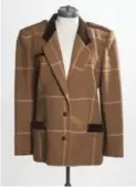  ?? BERNARD WEIL/TORONTO STAR ?? Valentino blazer, brown with suede detail, size 6, $50.