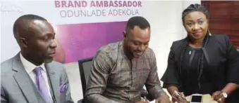  ??  ?? L-R: Bamidele Onalaja, CEO Revolution­Plus Properties, Nollywood star, Odunlade Adekola and Executive Director, Revolution­Plus Properties, Tolulope Onalaja at the agreement signing and presentati­on of Adekola as the company’s brand ambassador in Ikeja, Lagos… recently