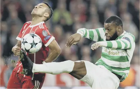  ??  ?? Celtic midfielder Olivier Ntcham stretches out to deny Bayern Munich’s Tiago in the Allianz Arena last night.