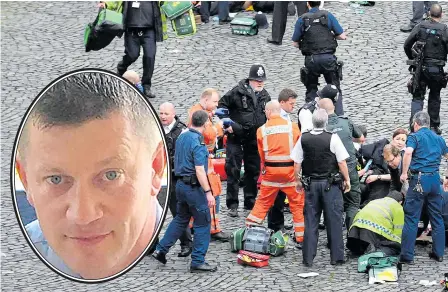  ?? Picture: PA ?? Paramedics try in vain to save PC Keith Palmer, inset, who was attacked outside the Houses of Parliament last year