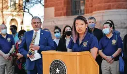  ?? Billy Calzada / Staff photograph­er ?? Christina Lew, president of the Chinese American Citizens Alliance San Antonio Lodge, speaks against the recent vandalism at the Noodle Tree restaurant.